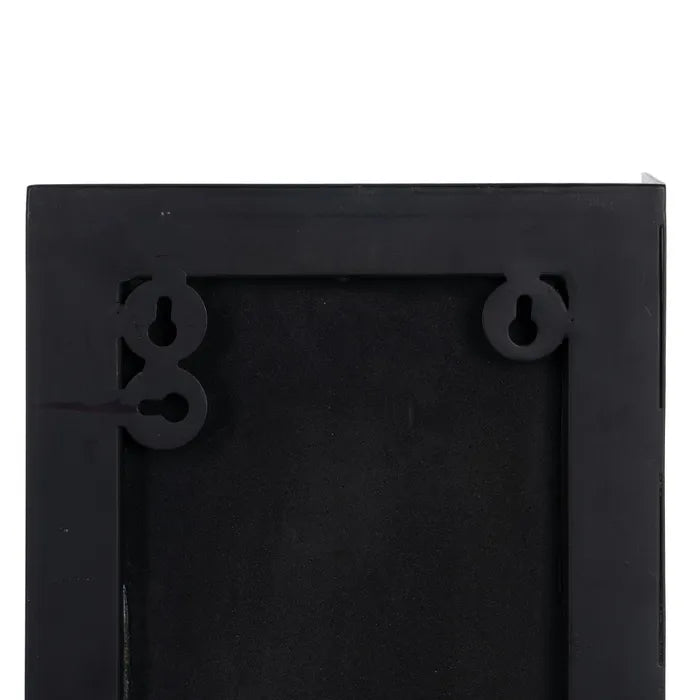 Close-up of the back of a black rectangular picture frame or wall-hanging frame, showing mounting holes and a textured black backing | KULORI Malta & Gozo