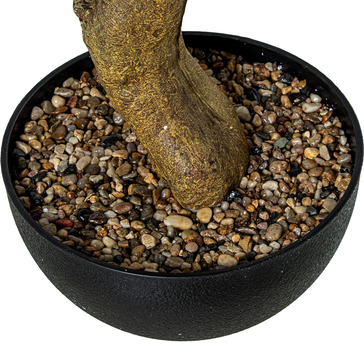 A close-up of a potted bonsai-style tree trunk in a round black cast-iron pot filled with small multicolored pebbles | KULORI Malta & Gozo