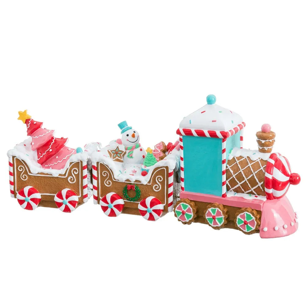 A festive gingerbread train decoration with three cars, decorated with candy canes, a small Christmas tree, a snowman, and icing-like white details, shown on a plain white background.