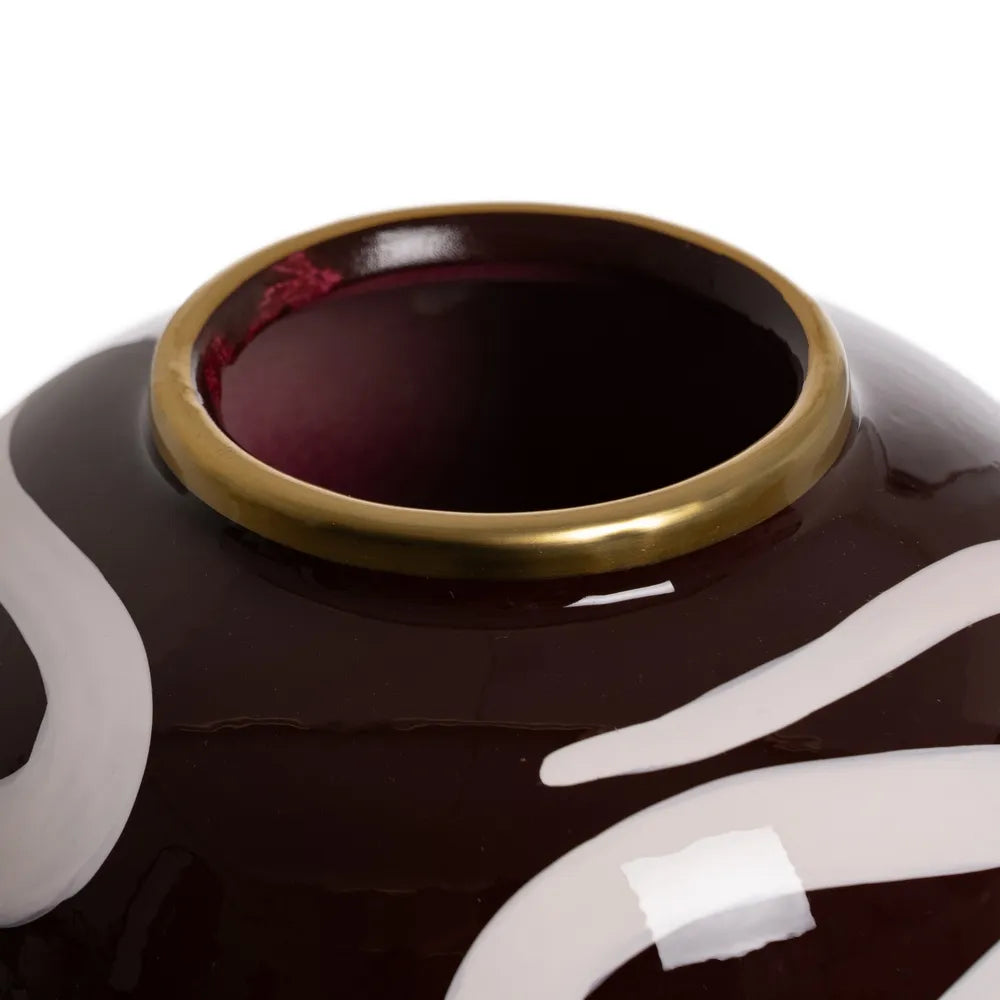 Close-up of a decorative vase with a gold rim and white patterns | KULORI Malta & Gozo