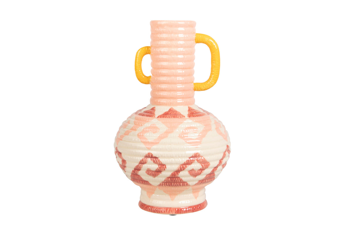 A ceramic vase with a ribbed pale pink neck, a yellow handle, and a cream-colored body decorated with a coral pink geometric diamond pattern, isolated on a white background | KULORI Malta & Gozo