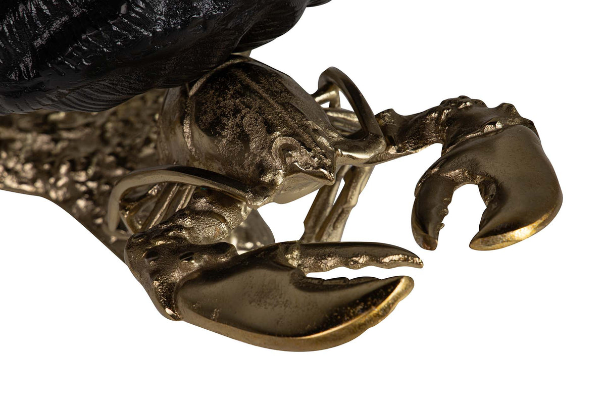 Close-up detail of a lobster chapagne cooler with metallic gold-toned claws and body | KULORI Malta & Gozo