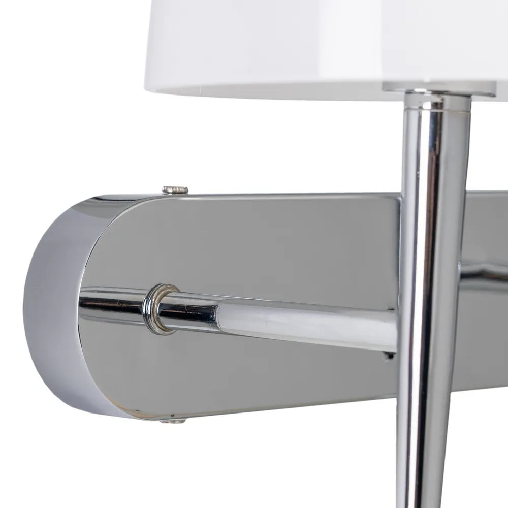 Close-up of a metallic table with a white lampshade on a white background