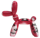 Pink balloon dog sculpture with graffiti text | KULORI