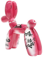 Pink balloon dog sculpture with black graffiti designs | KULORI
