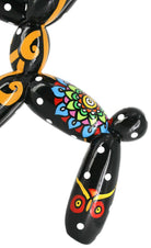 Decorative balloon dog sculpture with black, orange, and colourful patterns | KULORI