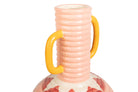 A close-up of a ceramic vase with a ribbed pale pink neck, two thick glossy mustard-yellow handles, and a white lower body decorated with red floral patterns, isolated on a white background | KULORI Malta & Gozo