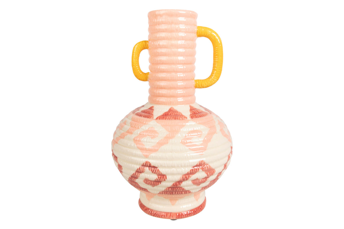 A ceramic pitcher with a ribbed neck, two yellow handles, and a bulbous body decorated with pink and white geometric patterns, isolated on a white background | KULORI Malta & Gozo