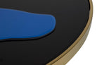 Close-up of a glossy black circular product with a gold-toned rim and a blue curved accent | KULORI Malta & Gozo