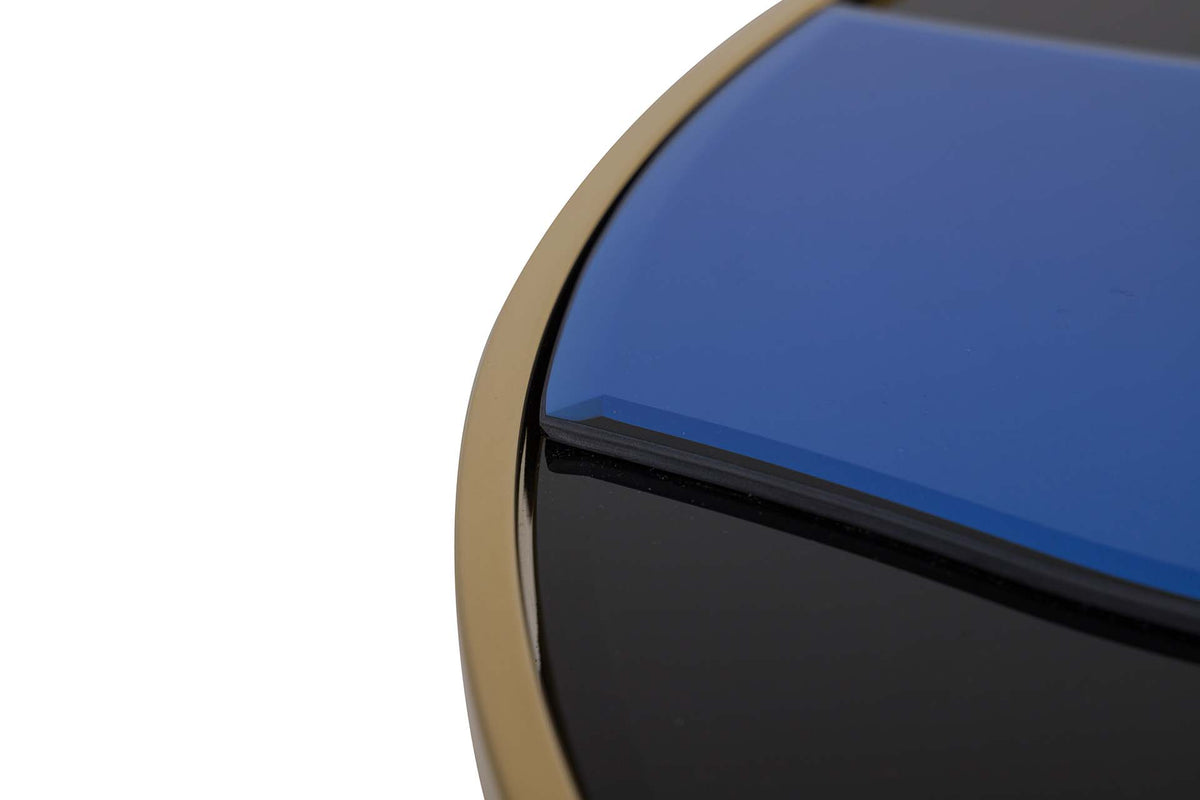 Close-up detail of a glossy blue and black oval object with a gold-toned rim | KULORI Malta & Gozo