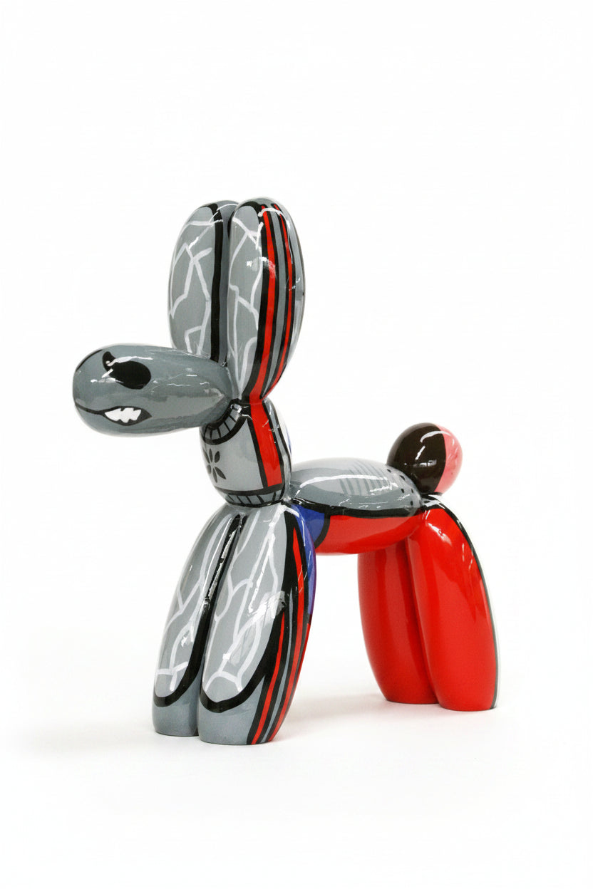 Metallic balloon dog sculpture with red, silver, and black colors on a white background | KULORI