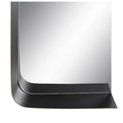 A close-up of a square wall mirror with a thick, black frame featuring a modern, curved bottom border and a subtle gold-toned edge accent | KULORI Malta & Gozo