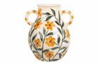 A cream-colored ceramic vase with two loop handles, decorated with a hand-painted pattern of yellow flowers and green leaves