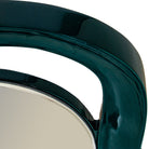 Close-up of a glossy dark teal-green curved frame with a reflective silver-toned mirror surface visible at the bottom left | KULORI Malta & Gozo