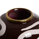Close-up of a decorative vase with a gold rim and white patterns | KULORI Malta & Gozo