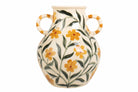 A cream-colored ceramic vase with two loop handles, decorated with a hand-painted pattern of yellow-orange flowers and green leaves.