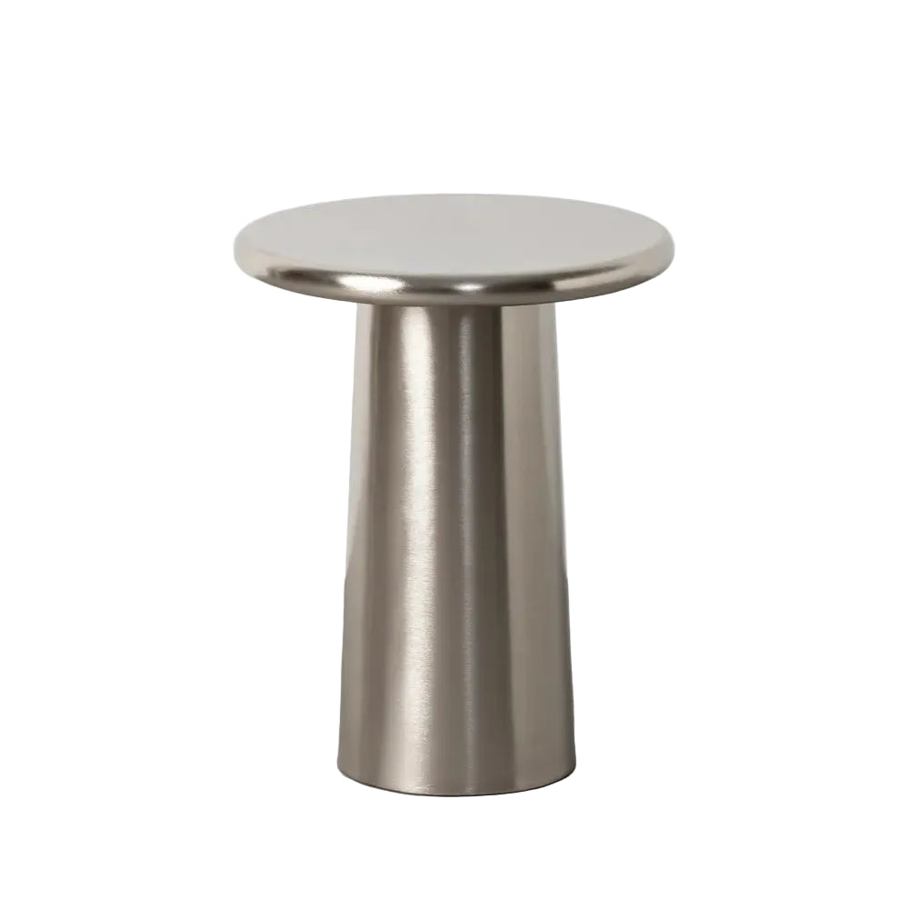 A modern round side table with a brushed metallic silver base and a flat circular top | KULORI Malta & Gozo