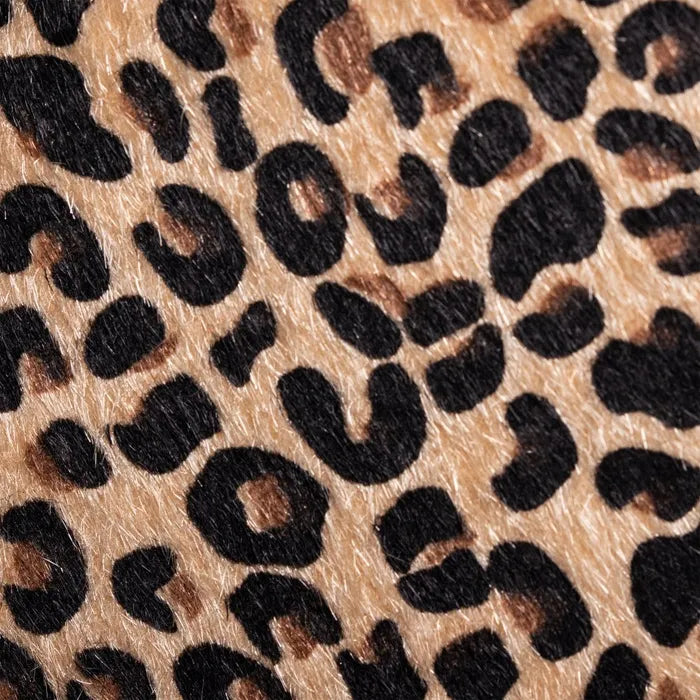 A close-up of leopard print material with irregular black spots | KULORI Malta & Gozo