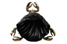 A decorative crab figurine with metallic gold claws and legs surrounding a large black shell-shaped body | KULORI Malta & Gozo