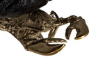 Close-up detail of a lobster chapagne cooler with metallic gold-toned claws and body | KULORI Malta & Gozo