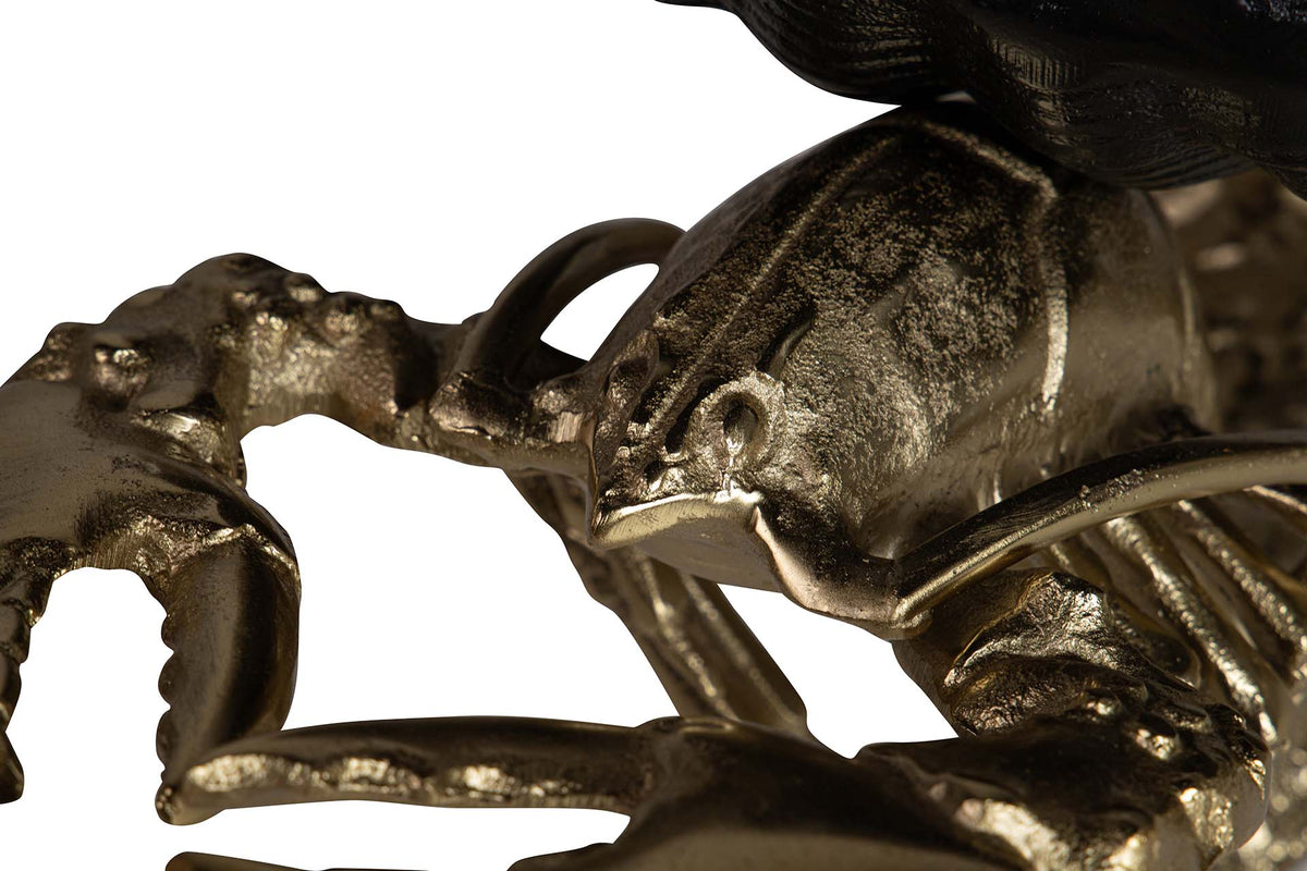 Close-up detail of a metallic lobster sculpture of champagne cooler with a textured, antique gold finish | KULORI Malta & Gozo