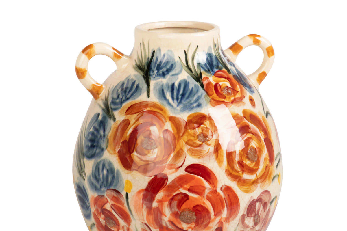 A ceramic vase with two loop handles, decorated with a hand-painted floral pattern of orange and red roses and blue flowers