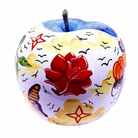 A decorative ceramic apple-shaped candle holder with a hand-painted design featuring a large red rose, yellow clouds | KULORI Malta & Gozo