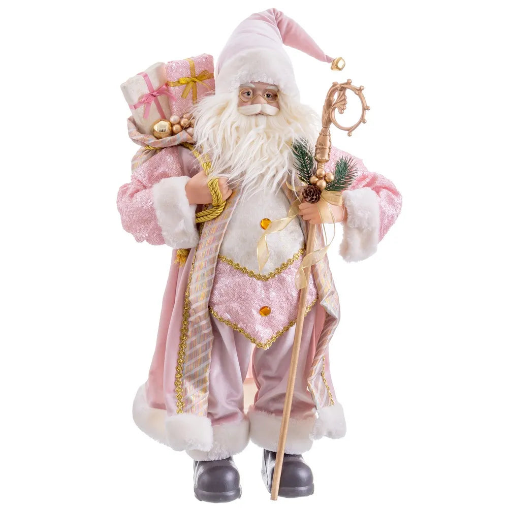 A festive Santa Claus figurine or decoration wearing a pink robe with white fur trim, carrying a sack of gifts and a staff, shown against a plain white background.