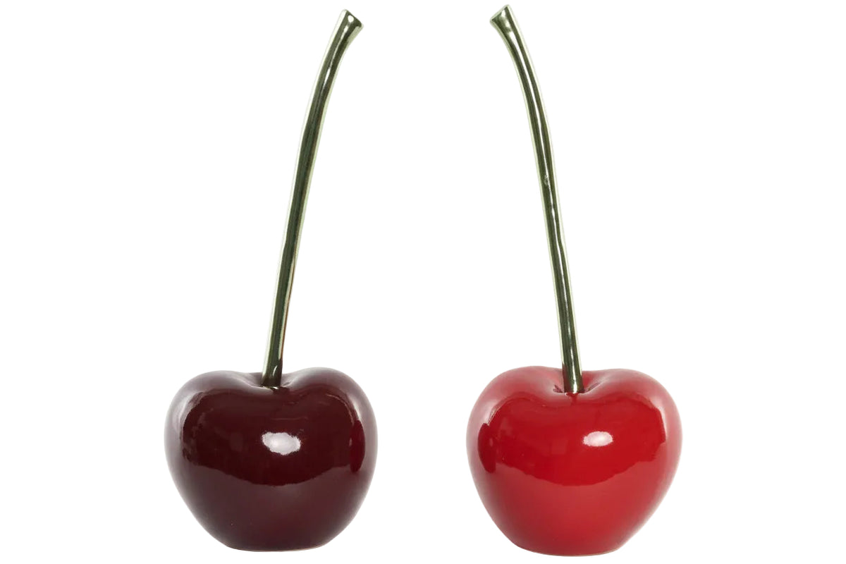Two glossy red cherries with dark green stems, shown side by side on a plain white background | KULORI