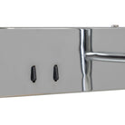 Close-up of a polished iron metal bar or trim with two switches wall lamp 