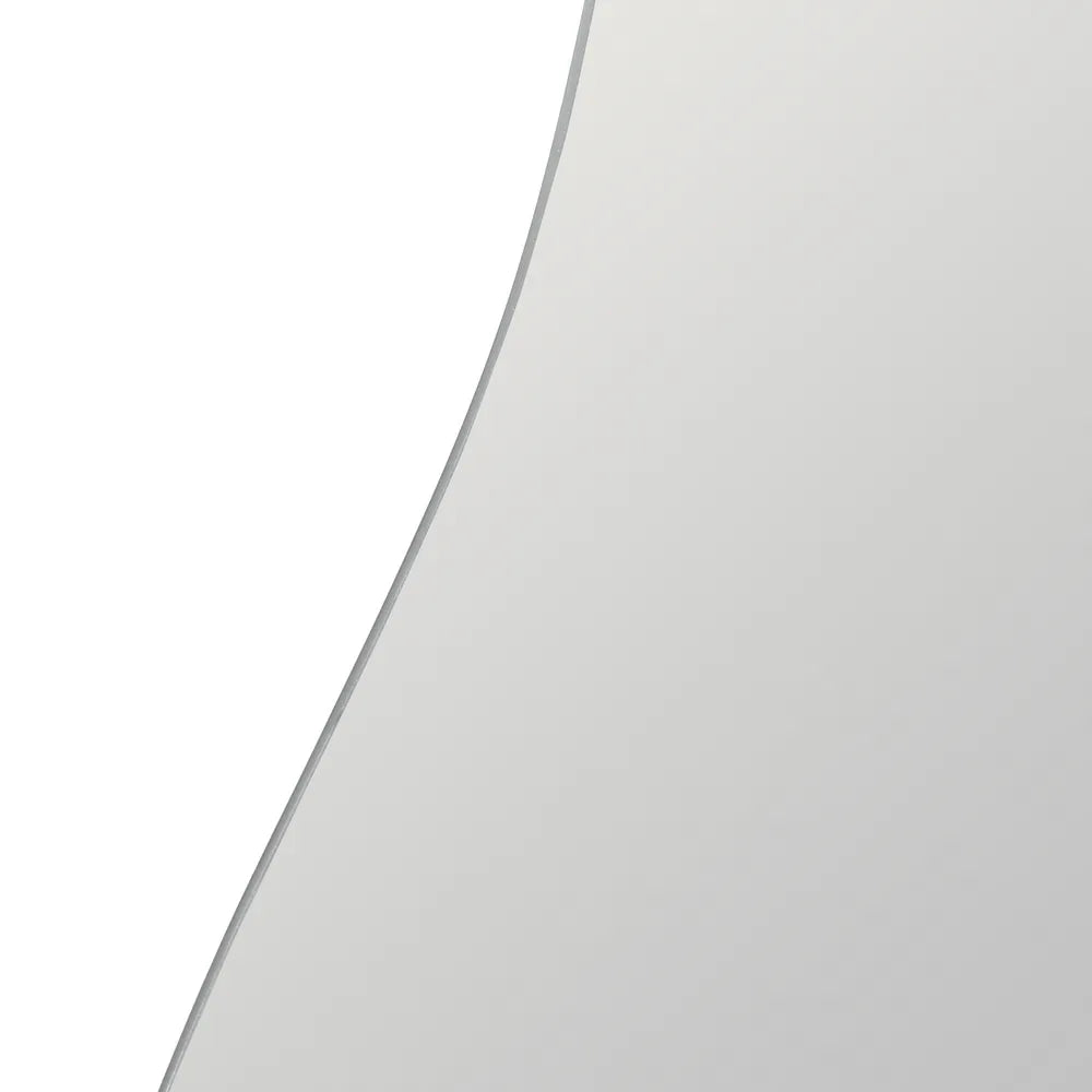 A close-up of a light gray curved surface, likely a mirror or glass panel, with a thin dark edge | KULORI Malta & Gozo