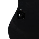 Close-up of a black electric guitar body with a visible pickguard | KULORI Malta & Gozo